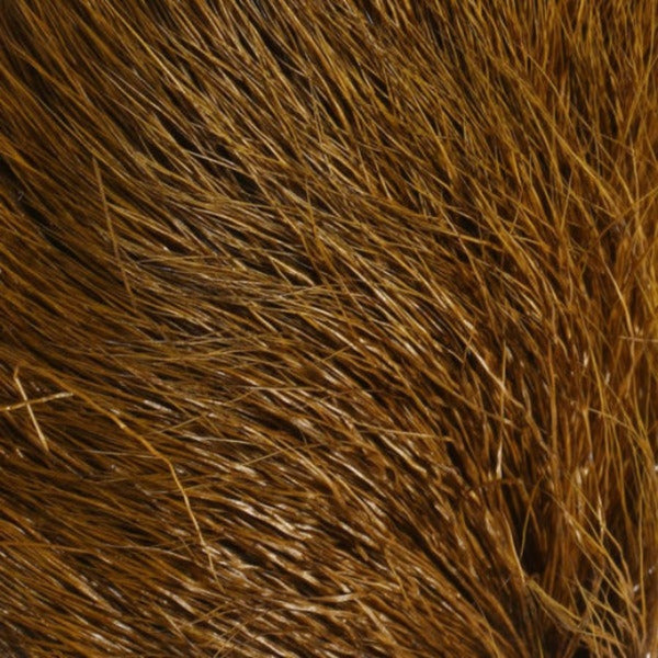 Close up of dyed olive brown Hareline Deer Belly Hair used for fly tying.