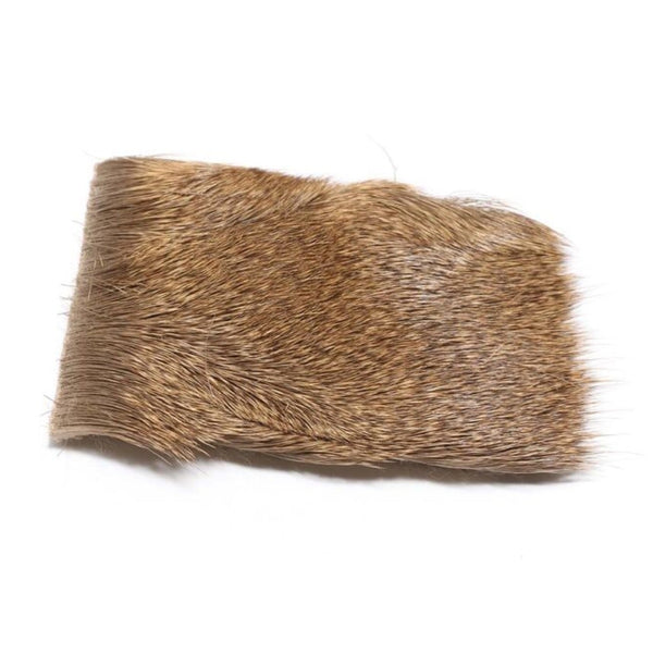 A patch of natural tan Hareline Elk Hock Hair used for fly tying on a white background.