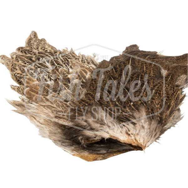 Natural variants of the Hareline India Hen Back, full of fly tying feathers, on a white background. 