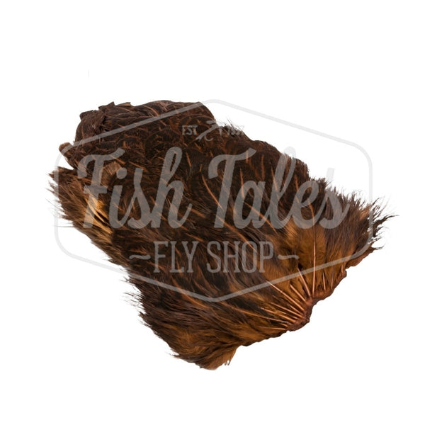 Dyed brown variant of the Hareline India Hen Back, full of fly tying feathers, on a white background. 