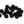 A large group of glossy jet black cyclops tungsten beads for fly tying on a white background.