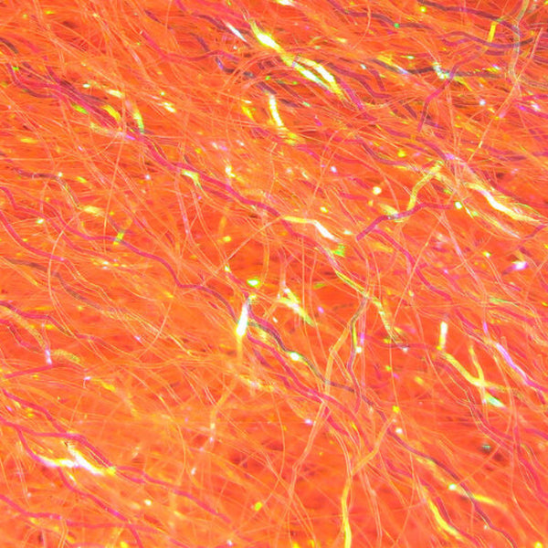 A close-up image of shrimp pink Hareline Ripple Ice Fiber, showing the shiny and characteristically crinkled strands.