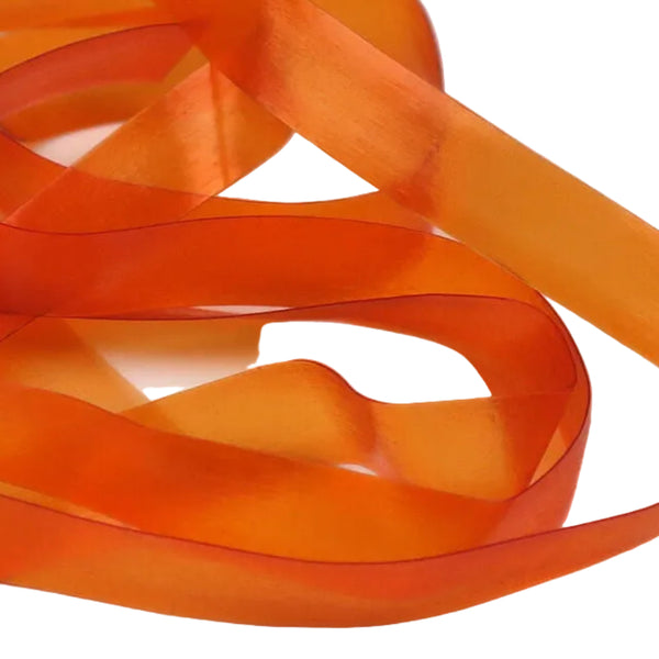 Orange color strip of semi-transparent and stretchy Hareline Scud Back fly tying body material, on a white background.