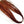 A skein of Hedron Dichromatic Flashabou Magnum for fly tying in red and gold, on a white background.