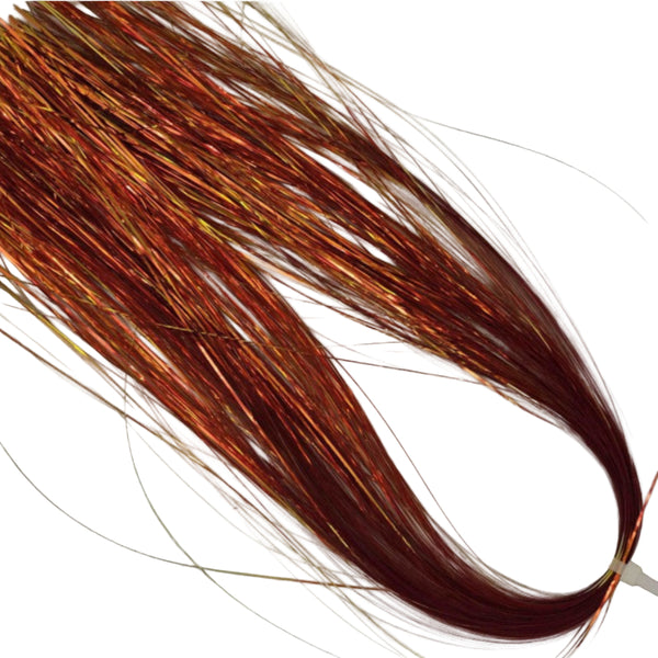 A skein of Hedron Dichromatic Flashabou Magnum for fly tying in red and gold, on a white background.