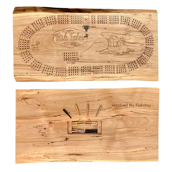 Front and back side of a 4-track wooden cribbage board made with live edge black walnut with engraved fly fishing design, on a white background.