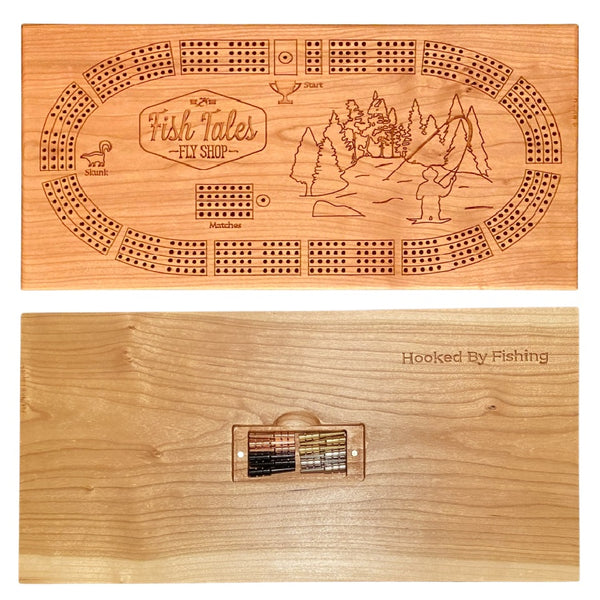 Front and back side of a 4-track wooden cribbage board made with cherry wood with engraved fly fishing design, on a white background.