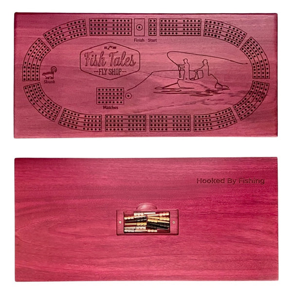 Front and back side of a 4-track wooden cribbage board made with purple heart with engraved fly fishing design, on a white background.