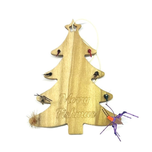A tree shaped wooden ornament with trout flies around the edge and "Merry Fishmas" engraving over a white background.
