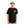 Person wearing a black Huk Outta This World t-shirt with graphics and text, standing against a white background