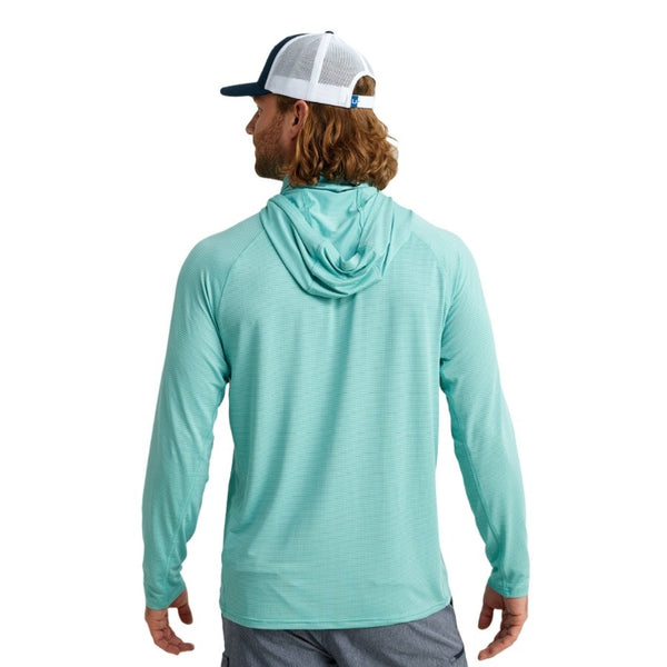 back view of a man wearing a marine blue huk fishing men's a1a performance sun hoody on a white background