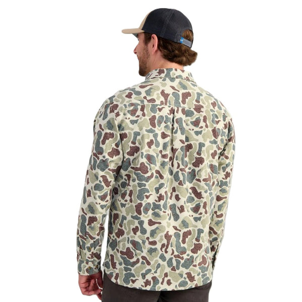 Person wearing the Huk Men's Chesapeake KC Army Camo Printed Flannel on a white background.