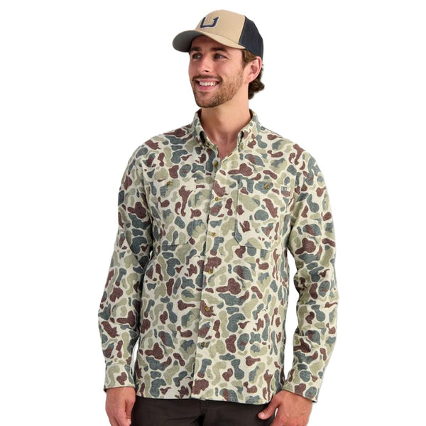 Person wearing the Huk Men's Chesapeake KC Army Camo Printed Flannel on a white background.