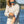 Man wearing a Huk KC Sand Camo Long-Sleeve Tide Point Shirt on a blurred background.
