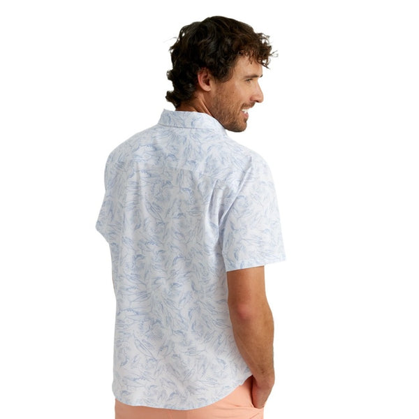back view of a man wearing a kc fish chaos print white huk fishing men's kona button down short sleeve shirt on a white background