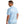 back view of a man wearing a huk fishing mens pursuit polo in upstream ice water blue on a white background