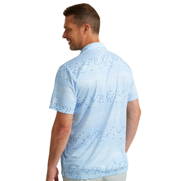 back view of a man wearing a huk fishing mens pursuit polo in upstream ice water blue on a white background