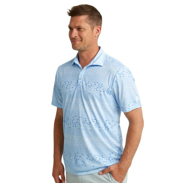 front view of a man wearing a huk fishing mens pursuit polo in upstream ice water blue on a white background