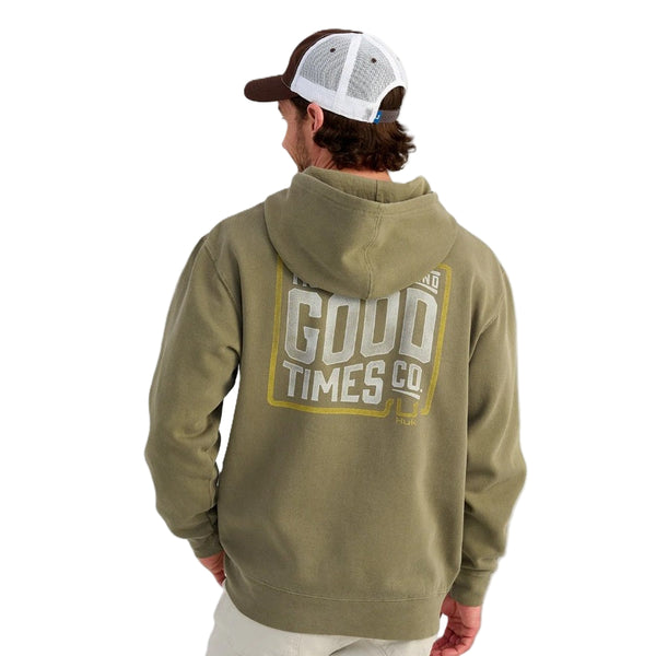 Person wearing a moss green Huk TighLine hoody with graphic on the back, over a white background.