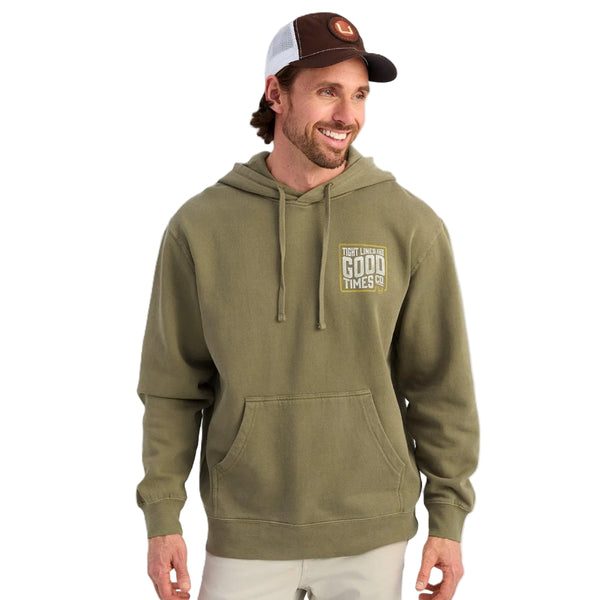 Person wearing a moss green Huk TighLine hoody with graphic on the front left, over a white background.