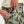Pocket details of the Huk Women's Cruiser Pants KC Volcanic Camouflage pants worn by a person on a white background.