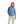 front view of a woman wearing a light blue huk fishing womens tide point button down long sleeve shirt and khaki pants on a white background