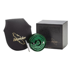 Islander IR3 Click Pawl Fly Reel in limited edition emerald green color, displayed next to its packaging box and a black neoprene carrying pouch with logo, against a white background.