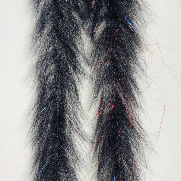 Close-up of a pair of bleeding black Just Add H2O Streamer Brush.