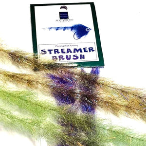 Two pairs of Just Add H2O Streamer Brushes in natural colors, arranged perpendicular across a packaged purple variant, against a white background.