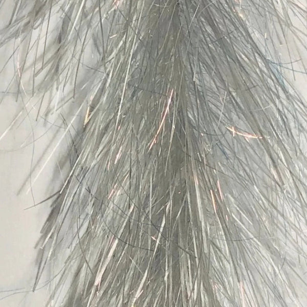 Close-up of steelhead grey Just Add H2O Translucy Fly Brush, on a white background.