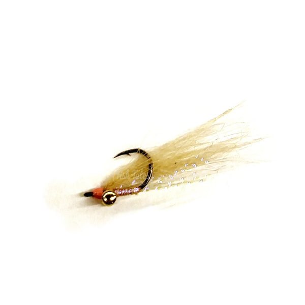 A Christmas Island Special bonefish fly in UV tan with gold barbell eyes on a white background.