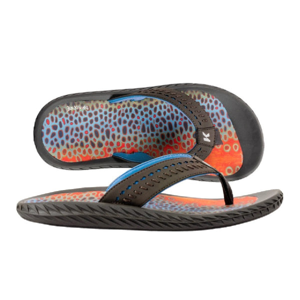 A pair of Korkers Men's Fish Flip Sandals with a black rubber outsole, featuring a multicolored fish print on  the top surface, on a white background.