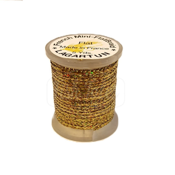 a single spool of gold lagartun mini flatbraid fly tying material on a white background 