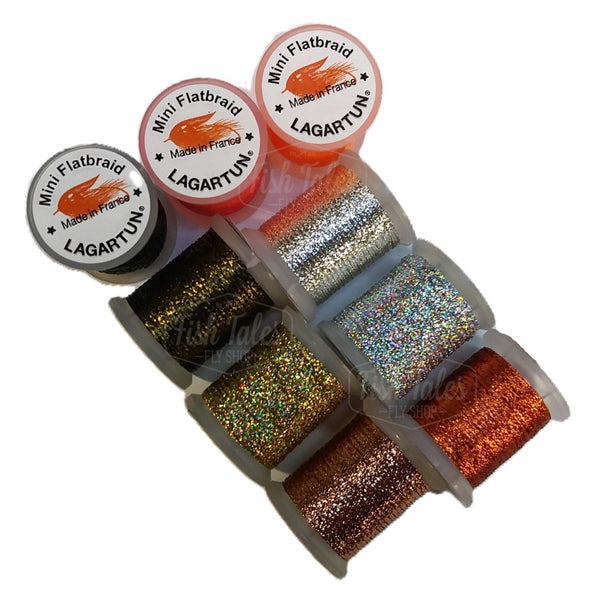 several spools of lagartun mini flatbraid fly tying material in natural and metallic colors on a white background 