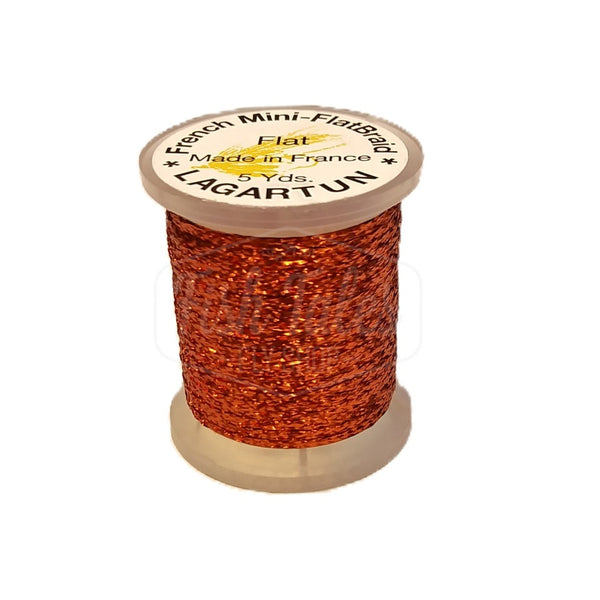 a single spool of rust lagartun mini flatbraid fly tying material on a white background 