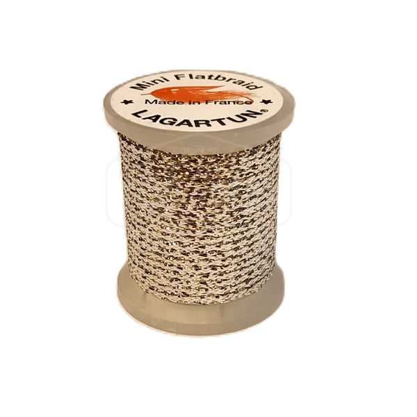 a single spool of silver lagartun mini flatbraid fly tying material on a white background 
