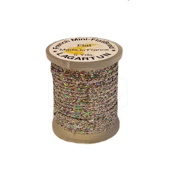 a single spool of holographic silver lagartun mini flatbraid fly tying material on a white background 