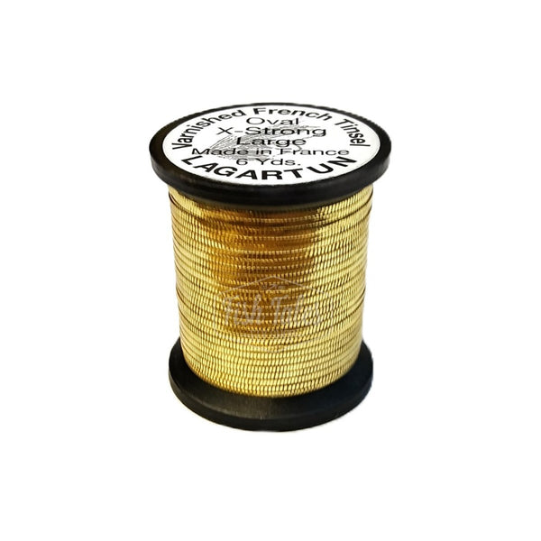 a single spool of gold lagartun oval metal fly tying tinsel on a white background 