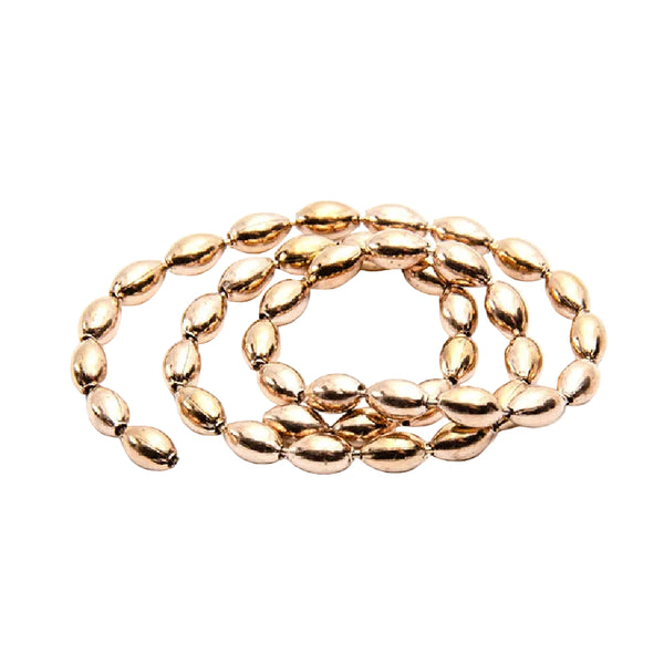 A coil of copper MFC Bulb Chain Eyes for fly tying on a white background.