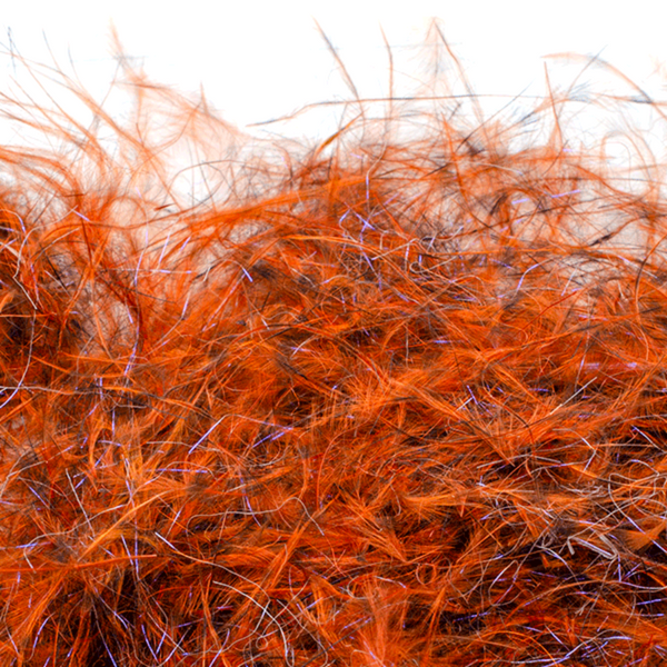 A close-up image of Senyo's Dirty Bird Dubbing, in cat vomit orange and brown showcasing a mix of marabou and synthetic fibers with hints of flash.