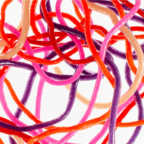 Strands of red, pink, purple and tan MFC Trina's Squirm Material for fly tying on a white background.