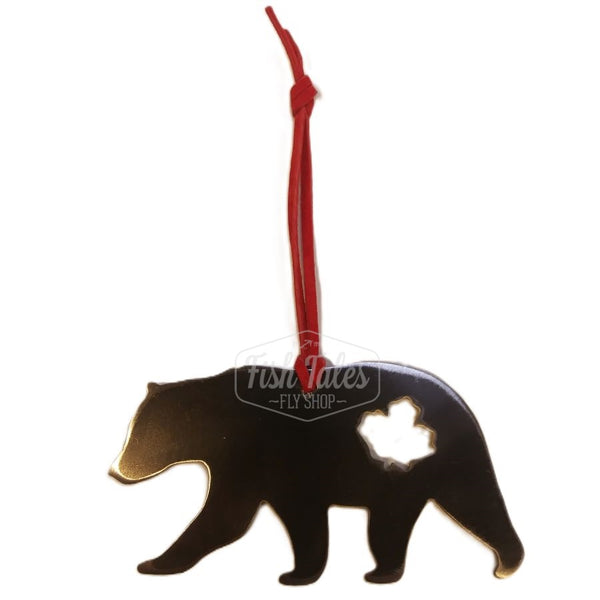 A Bear Silhouette MK Steel Canadian Animals ornament in dark steel with a leather hanger, in the shape of a walking bear with a maple leaf cutout.