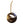 A round MK Steel fly fishing ornament in dark steel with a leather hanger, featuring a fly cutout in the center.