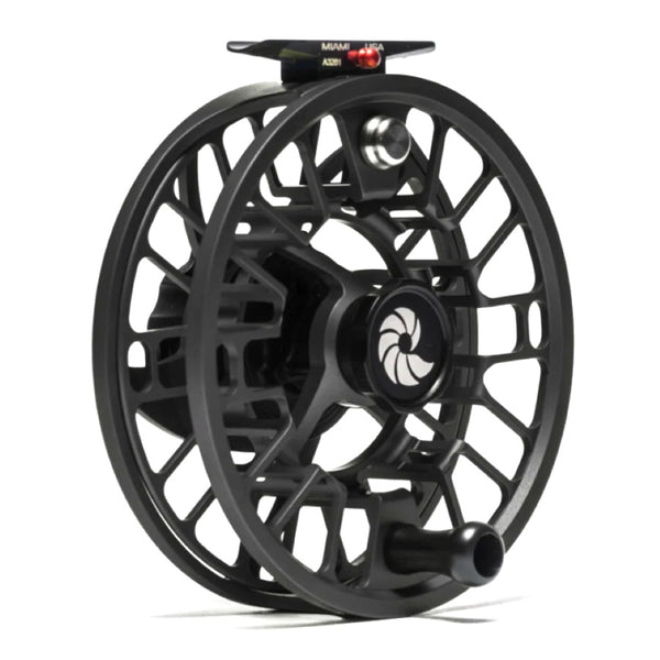 A Nautilus GTX Saltwater Fly Reel with a black body and silver and red details on a white background.