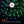 Colorful string lights of the Nebo luna 400 plus lantern on a dark grassy background.
