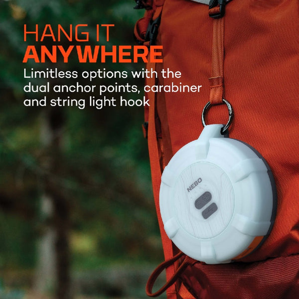 Nebo Luna 400 plus lantern attached to an orange backpack with a forest background.