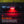 Red light emitting from a Nebo Slyde King 4k Flashlight on a textured surface with text about night vision preservation.
