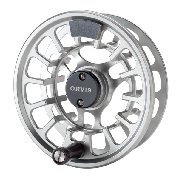 An Orvis Hydros fly fishing reel spool with a large arbor, featuring a matte anodized finish and an ergonomically improved drag knob on a white background.