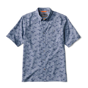 Front of the button down short sleeved men's Orvis Tech Chambray Shirt in medium blue with dark blue permit fish printed all over.