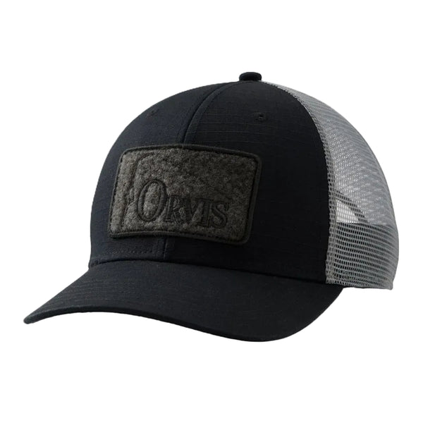 A black and slate grey Orvis Ripstop Trucker Hat, with an Orvis logo patch on the front, against a white background.